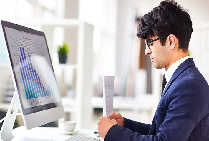 a man who sit front of computer